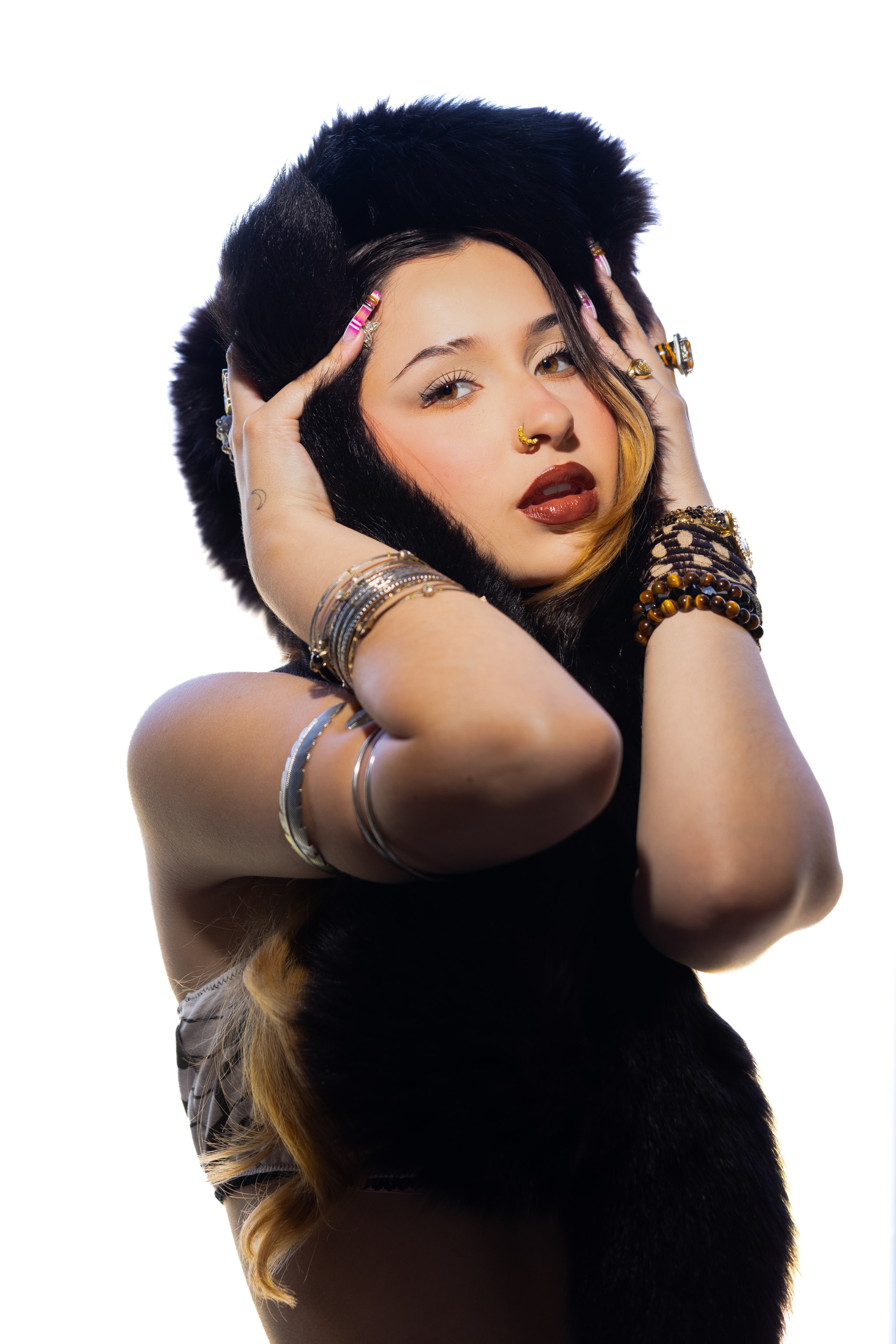 Sienna Melgoza in a black fur hat editorial portrait